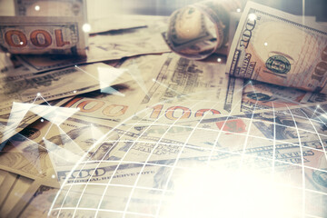 Double exposure of world map drawing over us dollars bill background. International concept.