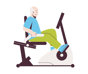 Elderly man rides stationary bicycle. Senior active lifestyle concept.