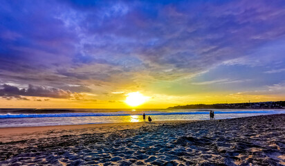 Colorful golden sunset big wave and beach Puerto Escondido Mexico. - obrazy, fototapety, plakaty