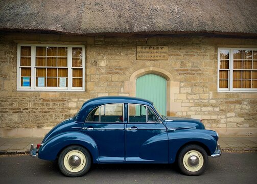 Classic blue Morris Minor in immaculate condition in Iffley Village, Oxford