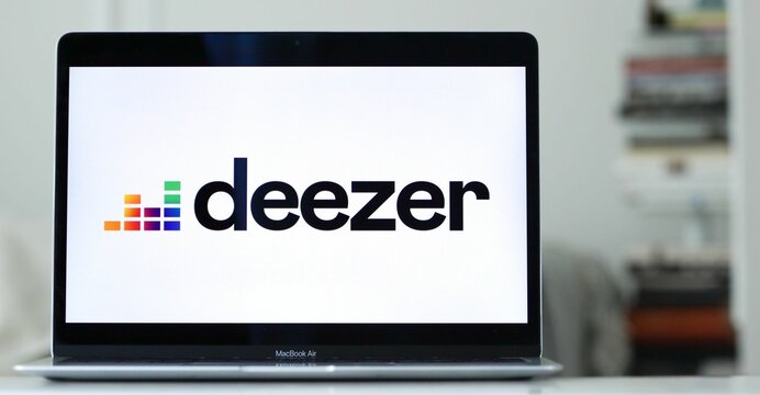 Laptop displaying the logo of Deezer, a music-streaming service company