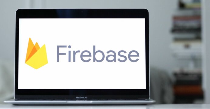 Logo of Google Firebase displayed on the screen of a laptop