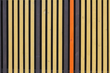 Colourful (yellow, orange and brown) wooden background from vertical planks