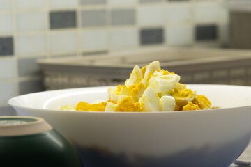 Salad with egg and peppers freshly prepared on kitchen counter