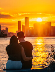 couple at sunset beach miami romantic sun reflection sea skyline buildings skyscrapers love 
