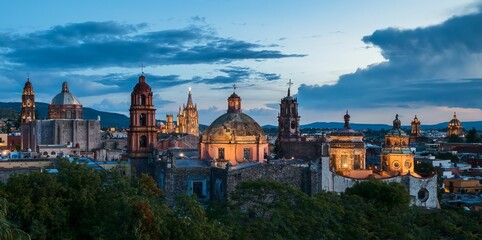Panoramic view of church domes of San Miguel de Allende, Mexico in twilight