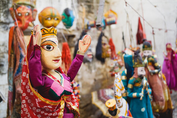Close-up of a traditional Indian puppet of a woman dressed in saree at a street shop of Indian...
