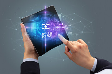 Businessman holding a foldable smartphone, technology concept
