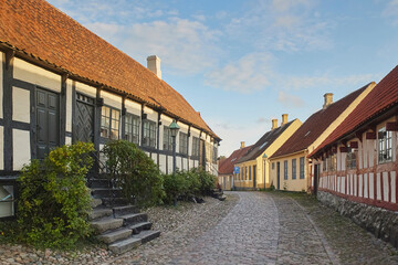 Fototapeta na wymiar Ebeltoft, Denmark. Cozy beautiful street with old houses 