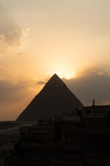 Fototapeta na wymiar The Sunset Behind an Egyptian Pyramid
