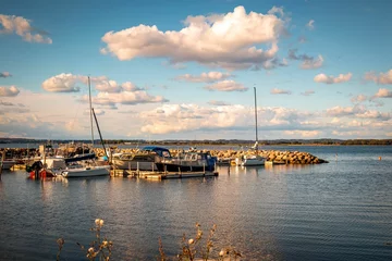 Photo sur Plexiglas Ville sur leau Beautiful seaside landscape with moored yachts, boats in marina under blue cloudy sky on sunny day