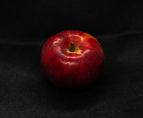 red apple on a dark background