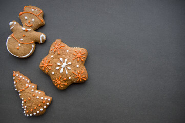 Set of different homemade Christmas cookies isolated on background, close up view with copy space for text. New year frame with tasty gingerbread cookies with spices. Winter holiday concept
