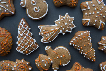 Set of different homemade Christmas cookies isolated on background, close up view with copy space for text. New year frame with tasty gingerbread cookies with spices. Winter holiday concept