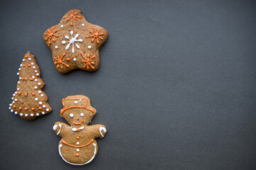 Set of different homemade Christmas cookies isolated on background, close up view with copy space for text. New year frame with tasty gingerbread cookies with spices. Winter holiday concept