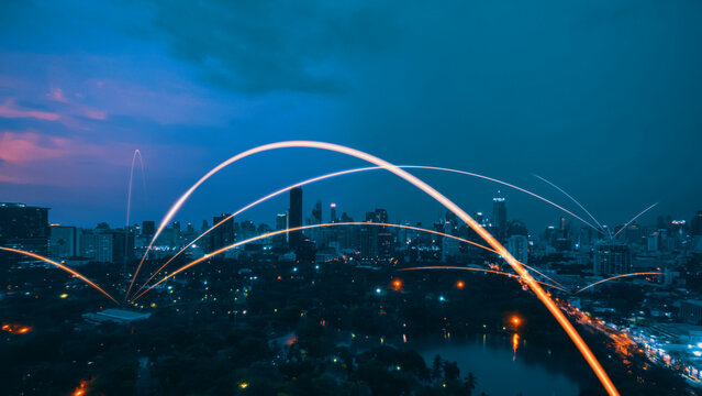 Smart digital city with connection network reciprocity over the cityscape . Concept of future smart wireless digital city and social media networking systems that connects people within the city .