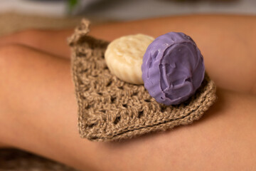 Handmade soap on the girl's body. Body cosmetics.