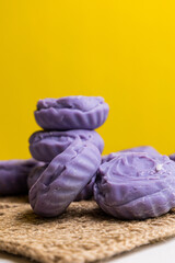 Decorative cosmetics. Lavender handmade soap on a yellow background.