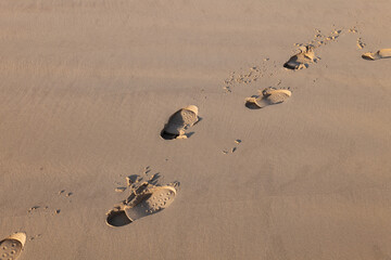 7 October 2022. Cullen, Moray, Scotland. This is boot prints on the slightly wet sand at Cullen Bay.
