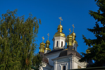 Fototapeta na wymiar Golden cupolas of Church of the Nativity of the Blessed Virgin Mary in Kyiv Pechersk Lavra monastery, Ukraine