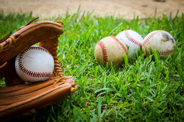 Close-up of Baseball Equipment including baseball glove and balls at park in Central Florida