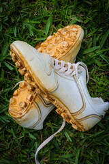 Close-up of dirty baseball cleats at park in Central Florida