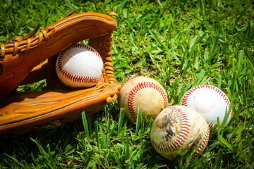 Close-up of Baseball Equipment including baseball glove and balls at park in Central Florida
