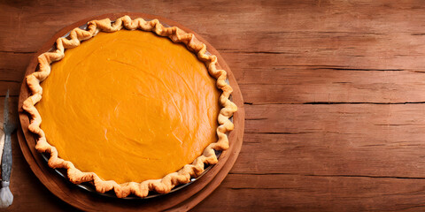 halloween Pie with pumpkin on wooden background