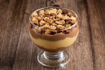 Dessert in the glass. Pastry cream dessert with chocolate ganache.