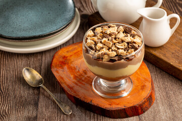 Dessert in the glass. Pastry cream dessert with chocolate ganache.