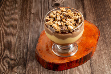 Dessert in the glass. Pastry cream dessert with chocolate ganache.