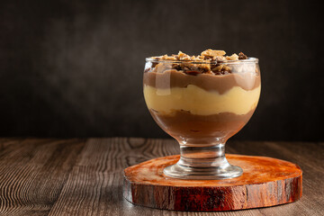 Dessert in the glass. Pastry cream dessert with chocolate ganache.