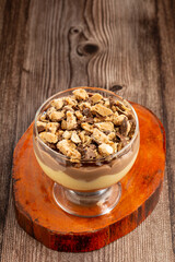 Dessert in the glass. Pastry cream dessert with chocolate ganache.