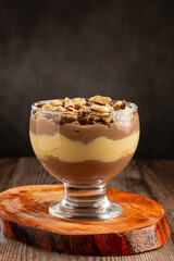 Dessert in the glass. Pastry cream dessert with chocolate ganache.