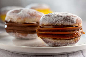 Berlin balls. Bread filled with pastry cream and topped with sprinkled sugar.