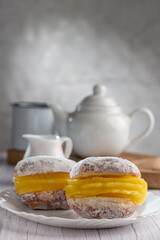 Berlin balls. Bread filled with pastry cream and topped with sprinkled sugar.