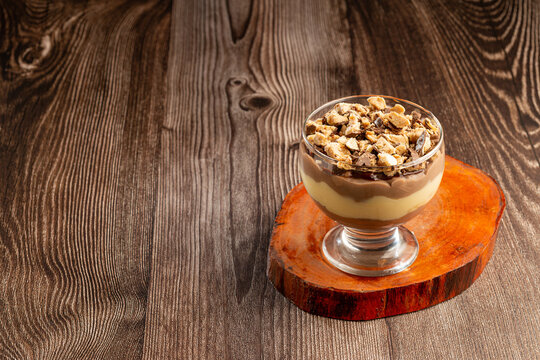 Dessert in the glass. Pastry cream dessert with chocolate ganache.
