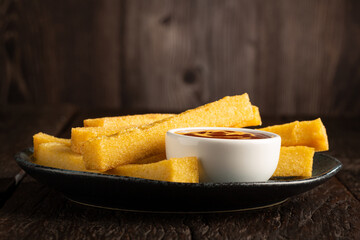 Homemade fried polenta on the table.