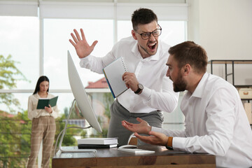 Boss screaming at employee in office. Toxic work environment