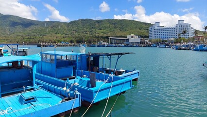 Fototapeta premium fishing port in Pingtung with blue sky and boats design for outdoor activity