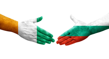 Handshake between Bulgaria and Ivory Coast flags painted on hands, isolated transparent image.