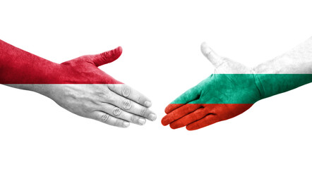 Handshake between Bulgaria and Monaco flags painted on hands, isolated transparent image.