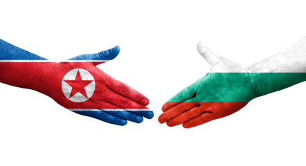 Handshake between Bulgaria and North Korea flags painted on hands, isolated transparent image.