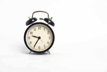 black vintage alarm clock isolated on white background, Time concept, 9:35 o'clock. Morning, reminder.