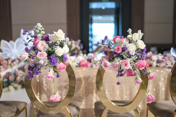 Wedding decoration with multi colors flowers and modern design table setting. Intimacy wedding ceremony or party indoors. 