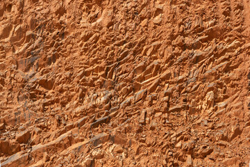 The excavation of the earth hill reveals the rock and soil cross-sectional background texture
