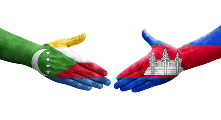 Handshake between Cambodia and Comoros flags painted on hands, isolated transparent image.