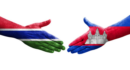 Handshake between Cambodia and Gambia flags painted on hands, isolated transparent image.