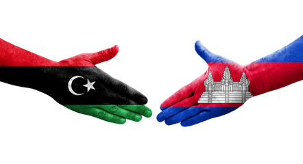 Handshake between Cambodia and Libya flags painted on hands, isolated transparent image.
