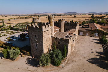 Fototapeta na wymiar Aerial view of a medieval castle with battlements and vaults.